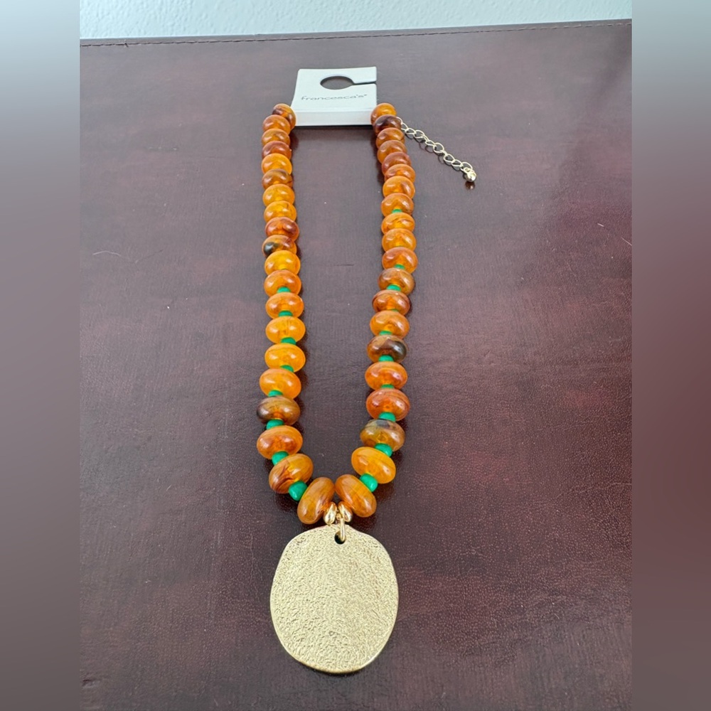 Francesca's Collections Orange and Brown Beaded Necklace with Gold Pendant